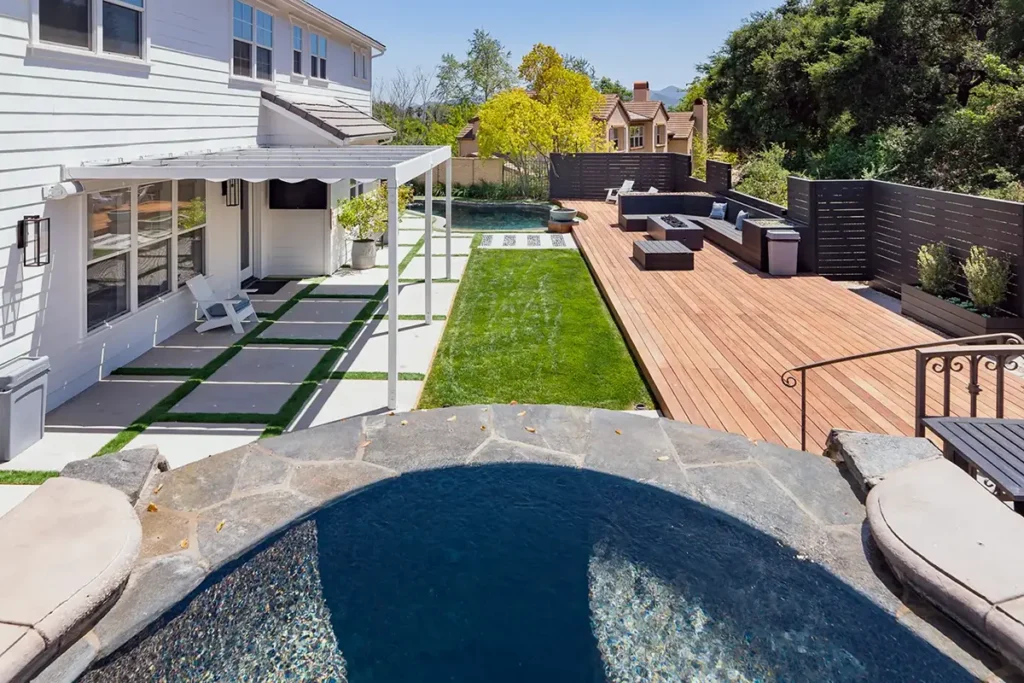 Landscape construction project featuring integrated hardscape, lawn, decking, and outdoor living areas designed and installed by Lush Gardens Inc.