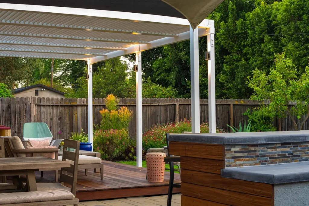 Custom pergola and covered outdoor patio structure designed and built for modern backyard living by Lush Gardens Inc.