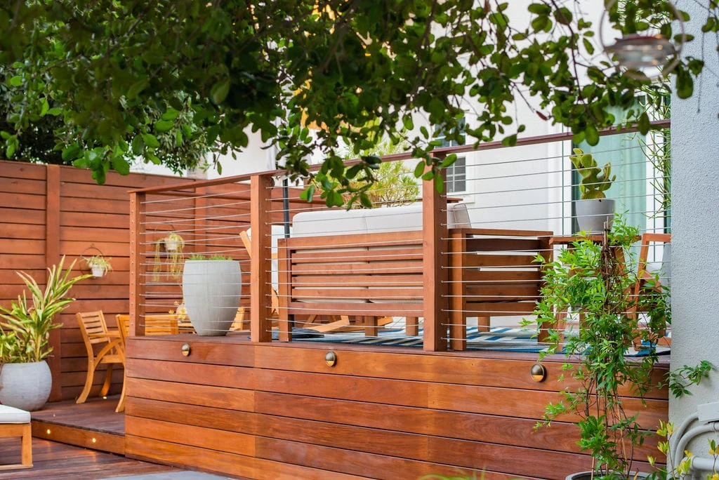 IPE wood deck with horizontal cable railing system and integrated deck lighting in Studio City, California